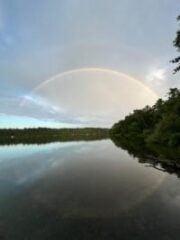 Photo of a rainbow over Long Pond
